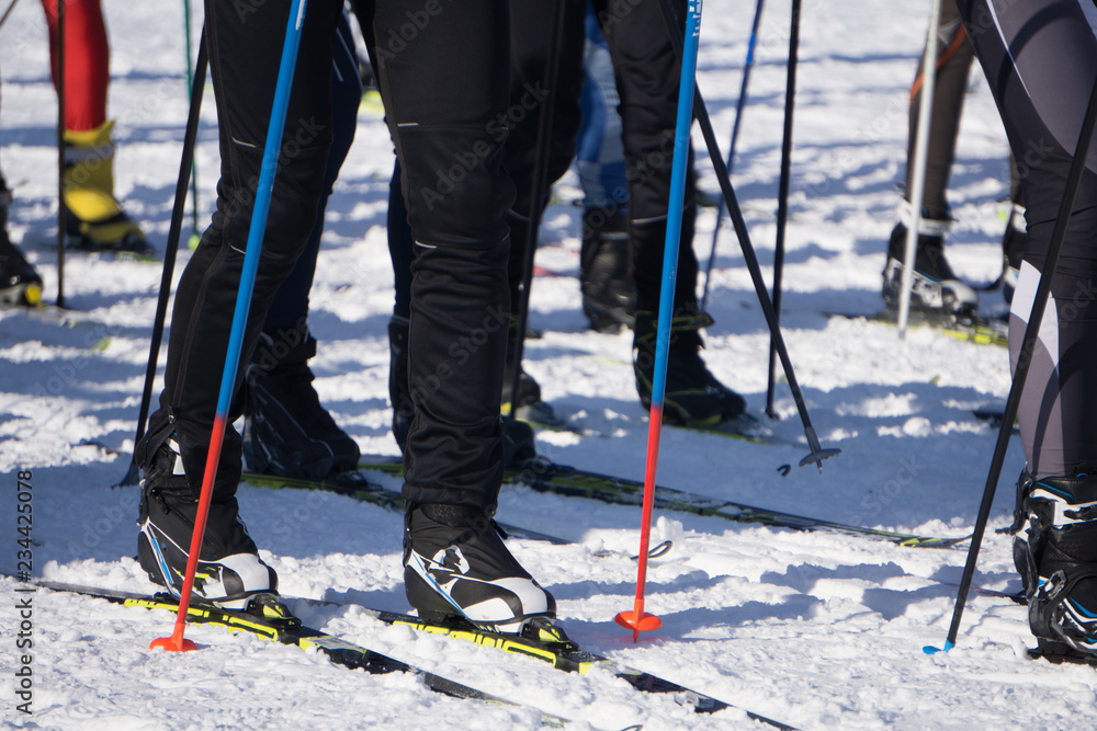 Ski marathon the view of the legs of the skiers feet of many athletes ...