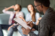 © rh2010 - African ethnicity psychologist making psychological test sitting with young couple in the green office