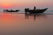 Indian Fishermen In Boats Early In The Morning, On The Ocean, Red Dawn, Low Tide