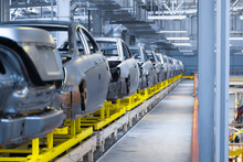 Movement Of Vehicles Along The Production Line At The Plant. Car Assembly Shop. Car Assembly By Parts