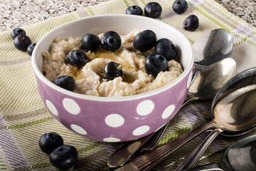 Wall Mural - porridge made with honey and blueberries