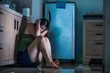 © TheVisualsYouNeed - young scared and helpless Asian Chinese woman horrified suffering domestic violence victim of abuse from drunk alcoholic husband at home kitchen floor crying