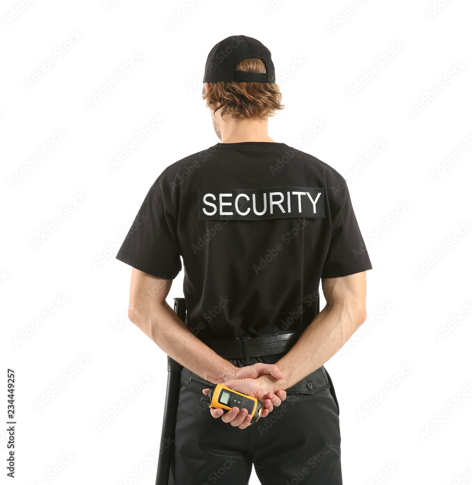 Male security guard with portable radio transmitter on white background