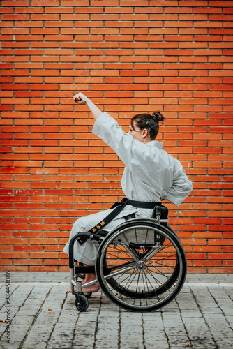 Fotografering Woman who training karate with wheelchair