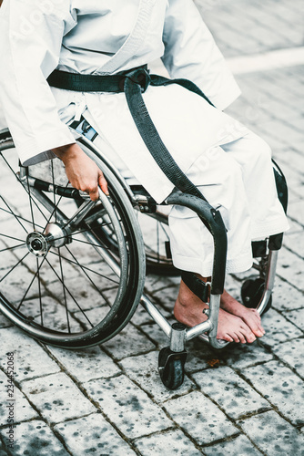 Woman who training karate with wheelchair Lerretsbilde