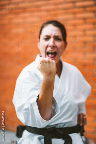 Fotografering Woman who training karate with wheelchair