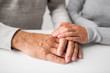 © Syda Productions - old age, family, care and support concept - close up of young woman holding senior man hands