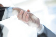 © yurolaitsalbert - business background. handshake of business partners above the Desk.