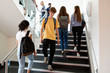 © Monkey Business - High School Students Walking On Stairs Between Lessons In Busy College Building
