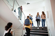 © Monkey Business - High School Students Walking On Stairs Between Lessons In Busy College Building