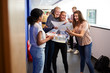 © Monkey Business - Excited Teenage High School Students Celebrating Exam Results In School Corridor