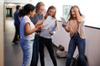 © Monkey Business - Excited Female Teenage High School Students Celebrating Exam Results In School Corridor