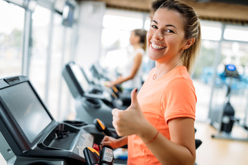 Group of friends exercising on treadmill machine