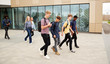 © Monkey Business - Group Of High School Students Walking Out Of College Building Together