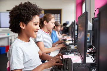 Wall Mural - Line Of High School Students Working at Screens In Computer Class