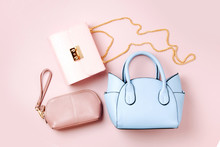 Fashion Handbags On Pale Pink Background. Flat Lay, Top View. Spring/summer Fashion Concept In Pastel Colored