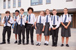 © Monkey Business - Portrait Of High School Student Group Wearing Uniform Standing Outside School Buildings