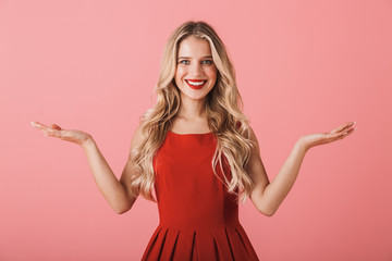 Wall Mural - Portrait of a smiling young woman in red dress