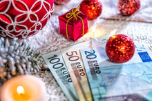 christmas ball with euro banknotes