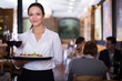 © JackF - Waitress standing in restaurant