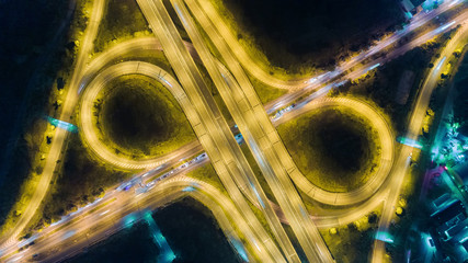 Wall Mural - Aerial top view highway road roundabout or circle at night for transportation, distribution or traffic background.