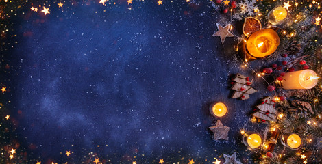 Christmas background with wooden decorations and candles. Free space for text