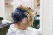 © Konstiantyn Zap - Woman dyed her hair blue at the hairdresser. Creative haircut and change the image of a woman. Hairdresser, stylist doing his job in the salon.