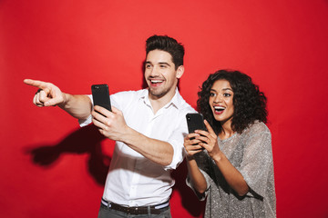 Wall Mural - Portrait of a cheerful young smartly dressed couple