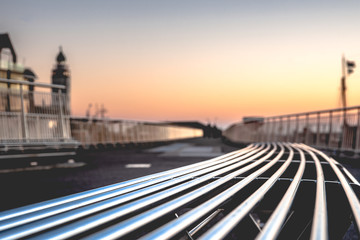 Low Angle View or circular seat with silver color bars along a walking path