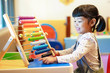© Asada - Cute Asian little kid girl playing with abacus at home. Smart child learning to count. learning, classroom, lesson concept.