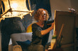 © cherryandbees - Redhead woman painting in her art studio