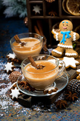 Wall Mural - winter treats, spiced masala tea and gingerbread man cookies, vertical top view