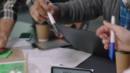 close up business people engineers developing software app web developers brainstorming solution planning design collaborating in office meeting