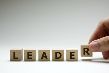 Leader word made from wood cubes or blocks with letters alphabet