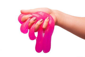 a toy for children mucus and liquid flowing on hand on a white background