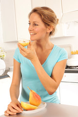 Wall Mural - WOMAN EATING A PEAR