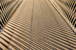 shadows of a handrail on a footbridge making abstract patterns in London England