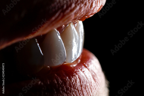 Cuadros en Lienzo White teeth with lips close up macro on dark background.