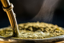 Steaming Delicious Yerba Mate In A Traditional Calabash Gourd, Horizontal Closeup.