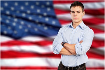 Canvas Print - Young male teacher   standing with book