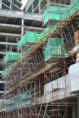 Wall Mural - Scaffolding used as the temporary structure to support platform, form work and structure at the construction site. Also used it as a walking platform for workers. 