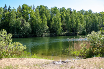 calm summer day view by the lake with clean water