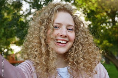 Selfie Photo Of Young Beautiful Lovely Girl Blonde With Curly Hair