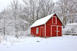 Beautiful Wisconsin winter nature background. Scenic view with red barns in the covered by fresh snow woods. Morning after blizzard. Agriculture, farming and rural life at winter background. 