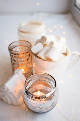 Still life details of nordic living room. Cozy winter scene in Scandinavian interior. Autumn winter candle composition, danish hygge concept