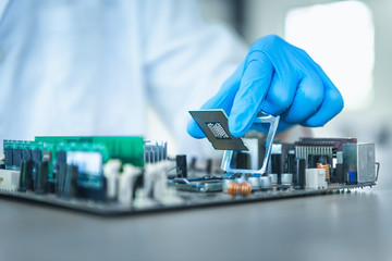 Close up portrait of computer engineer's hand is holding CPU's computer