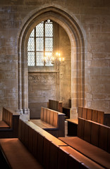 arched entrance to the side chapel and benches. in severin church in erfurt