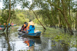 © Hanoi Photography - Tourism rowing boat in cajuput forest in floating water season in Mekong delta, Vietnam