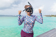 © mikumistock - Asian beautiful woman is snorkeling in the lagoon sea background.