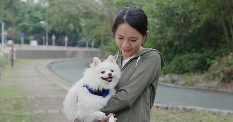 Wall Mural - Woman go out with Pomeranian dog